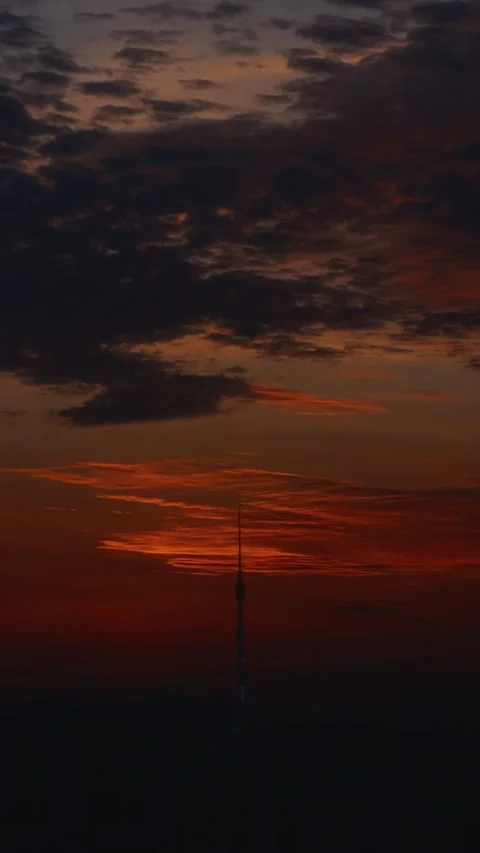 Ostankino Tower silhouette at dramatic sunset sky, vertical city view Vidéo 320137575