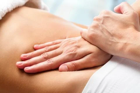 Osteopathic belly massage. Stock Photos