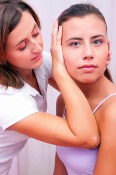 Osteopathic technical evaluation for cervical spine Stock Photos