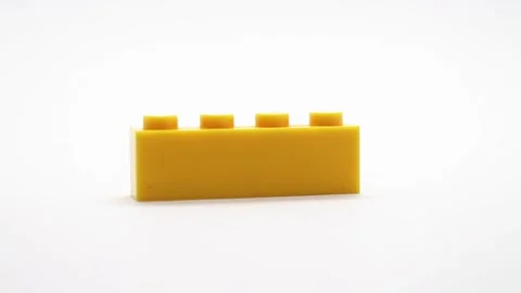 Ostrava, Czech republic - October 8th 2025: Yellow Lego brick piece Stock Footage 320407054