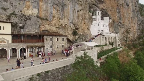 Ostrog Monastery in rock central Montenegro nature Orthodox Church Aerial 4k     Stock Footage 76732091