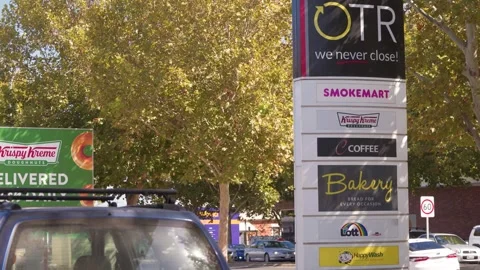 OTR Convenience Store Signage With Multiple Brand Logos On Australian Suburban Stock Footage 336028929