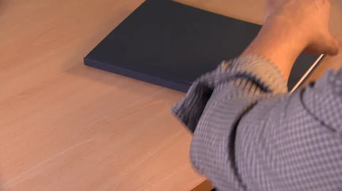 OTS Shot of Someone Opening and Writing in a Notebook Stock Footage 48685726