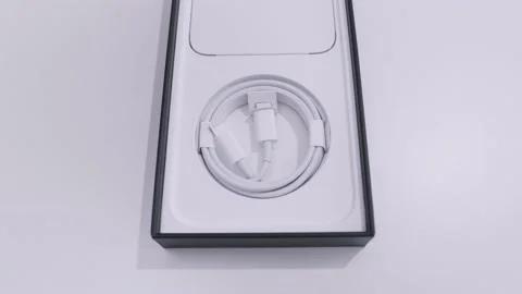 Ottawa, Canada - 11.24.2020 opened box of an Apple iPhone on a white table Stock Footage 143985918