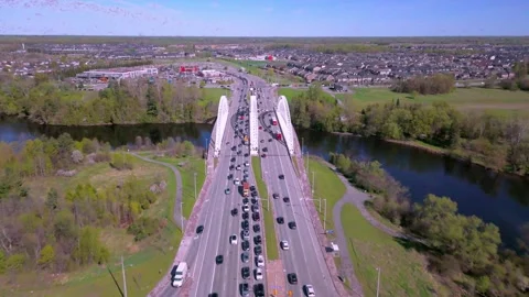 Ottawa, Canada - May 9, 2024: Vehicles dot the expanse of a bridge Stock Footage 274883715