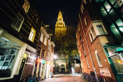 The Oude Church and .Wijde Kerksteeg at night, in Amsterdam, The Netherlands. Stock Photos