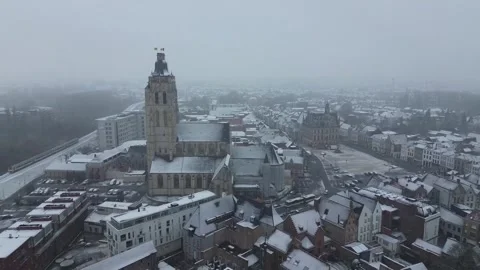 Oudenaarde during snowfall in winter aerial video Stock Footage 243098181