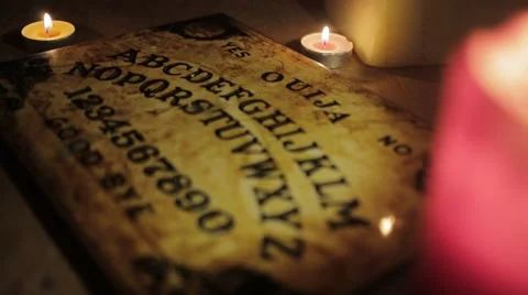 Ouija Board with Candles pull focus Stock Footage 58517293
