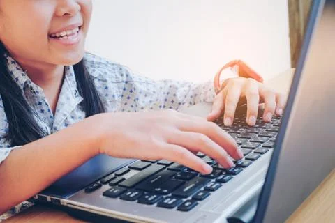 Oung cute kid using a computer Foto stock