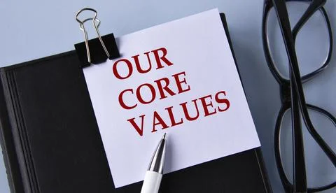 OUR CORE VALUES - words on a white piece of paper on a black notebook with .. Stock Photos