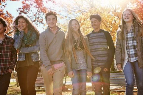 Our future is looking bright. a group of teenage friends enjoying an autumn day Stock Photos