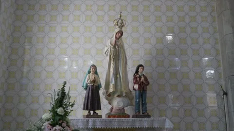 Our Lady of Fatima and shepherd children on altar in tiled chapel Stock Footage 345277355