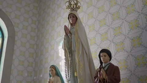 Our Lady of Fatima statue with shepherd children in tiled chapel Stock Footage 345277441