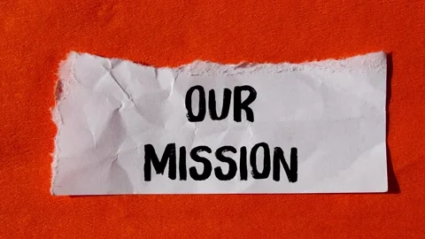 Our mission message writing on ripped torn paper background Stock Footage 344550375