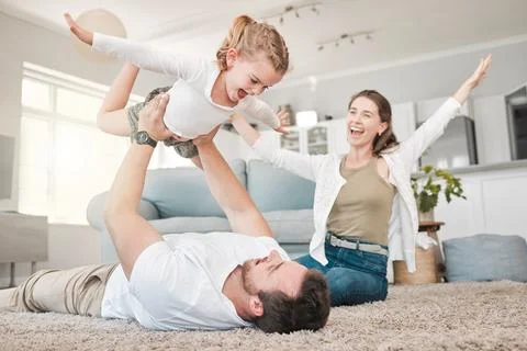 Our most basic instinct is for family. a young father and daughter bonding while Stock Photos