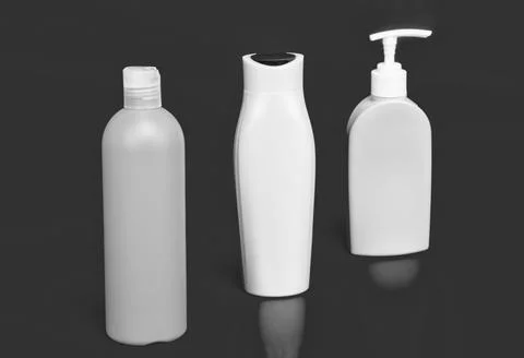 Our packaging solutions. Toiletry bottles pink background. Refillable bottles in Stock Photos