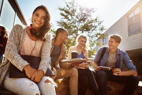 With our shared knowledge, well ace this exam. a student sitting outside on Stock Photos
