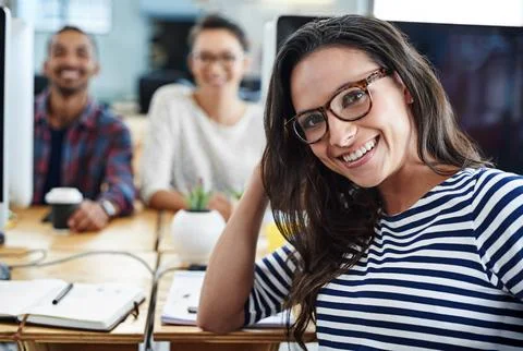 Our team is always on the same page. Portrait of a group of young office workers Stock Photos