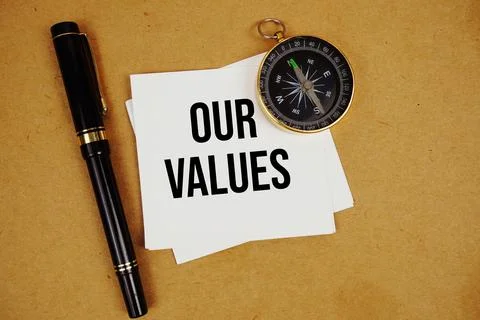 Our Values text on sticky note with compass and pen on paper craft background Foto stock
