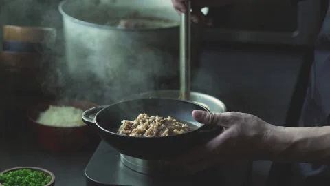Ouring Hot Curry over Rice and Adding Cheese Stock Footage 334172073