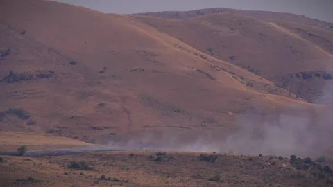 An out of control field forest burning bellowing smoke into the air and destroy Stock Footage 278805204