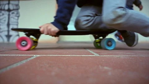 Out of focus of anonymous children playing skateboard outside a building Stock Footage 106036584