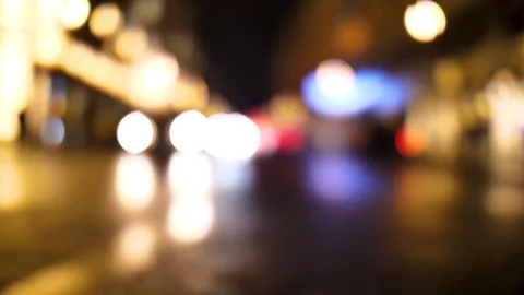 Out of focus approaching car on the night street Video stock 125818550