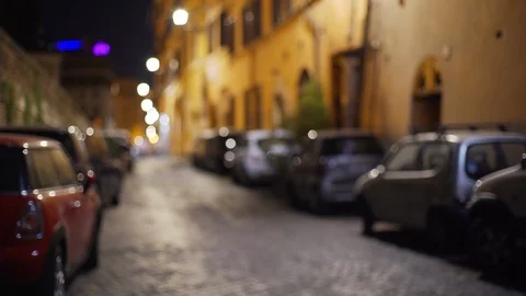 Out of focus background of cars parallel parked on a small street in Rome Italy Stock Footage 90218300