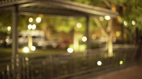 Out of focus background plate of empty path in beautiful urban park at night Stock Photos