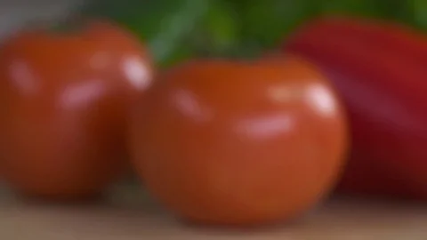 Out of focus background shot featuring tomatoes, red peppers, and green peppers. Stock Footage 72537580