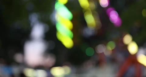 Out of focus bokeh background carnival ride with lights all over swings like Stock Footage 155415855