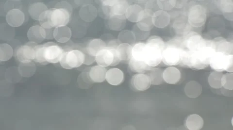 Out of Focus Bokeh Light Reflecting Silvery Sea Surface Stock Footage 51239606