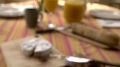Out of focus brunch spread of creamy brie cheese with jam spread, baguette Stock Footage 92805348