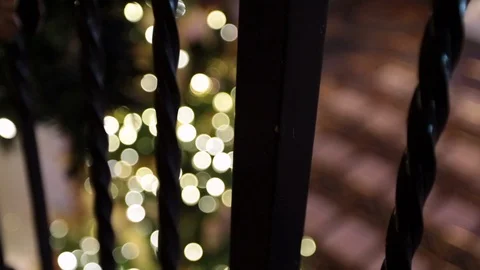 Out of focus Christmas tree through bannister rack focus 스톡 동영상 91198442