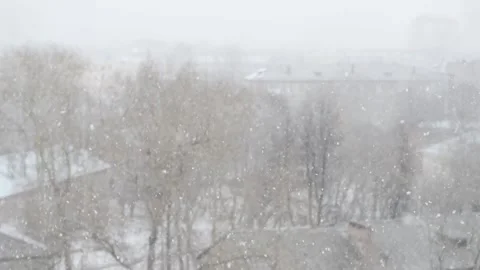 Out of focus city background with falling snowflakes. Stock Footage 164785631
