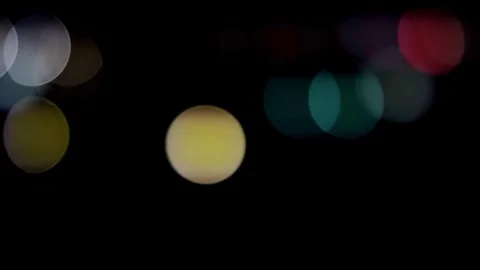Out of focus city lights create a bokeh background Stock Footage 329816336