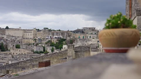 Out of focus clay pot with a stone village in the background Stock Footage 290177275