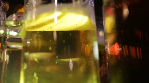 Out of focus, close-up of gas bubbles in a glass of light ale. Real-time, eve Stock Footage 87572420