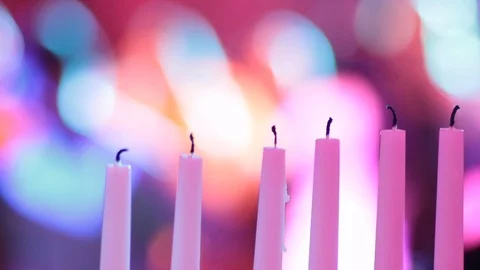 Out of focus dancing with candles in foreground 스톡 동영상 103546478