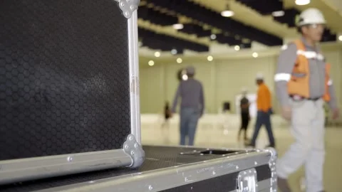  out-of-focus engineers at work setting up a stage for a conference Stock Footage 277468988