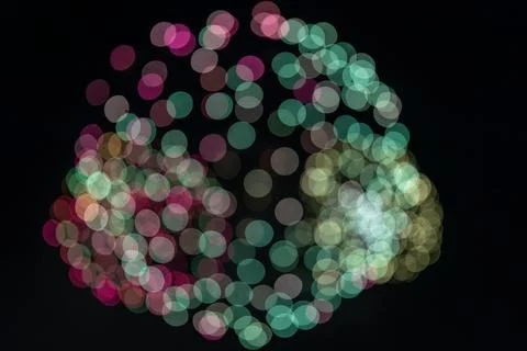 Out of focus exploding fireworks in the night sky Foto stock