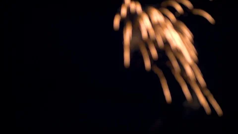 Out of Focus Firework Exploding with Falling Light Trails Stock Footage 92449180