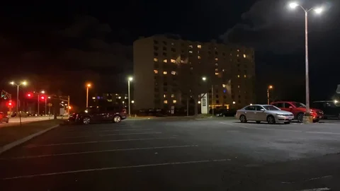 Out of Focus In to Focus Night Time Parking Lot Stock Footage 125224921