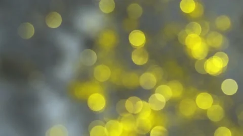 Out of focus gold light particles Bokeh. Golden yellow bokeh lights Stock Footage 150575170