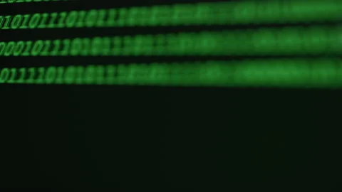 Out of Focus Green Binary on a Screen Video stock 208802354