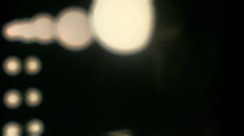Out of focus Led Light Bulbs burning on the mirror. Blurry Stock Footage 62876439