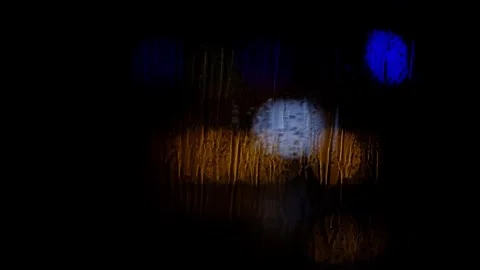 Out of focus lights in the rain Stock Footage 334297371