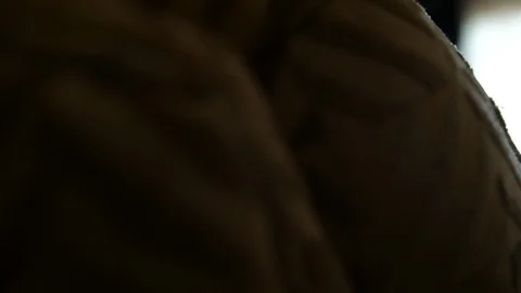 Out of focus man taking suit jacket of hanger in background Stock Footage 111400751