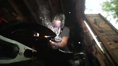 Out of Focus Metalsmith Welding Stock Footage 243204331