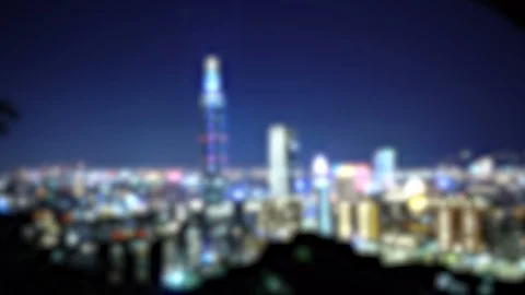 Out of Focus Modern City Skyline at Night 4K Stock Footage 106488752
